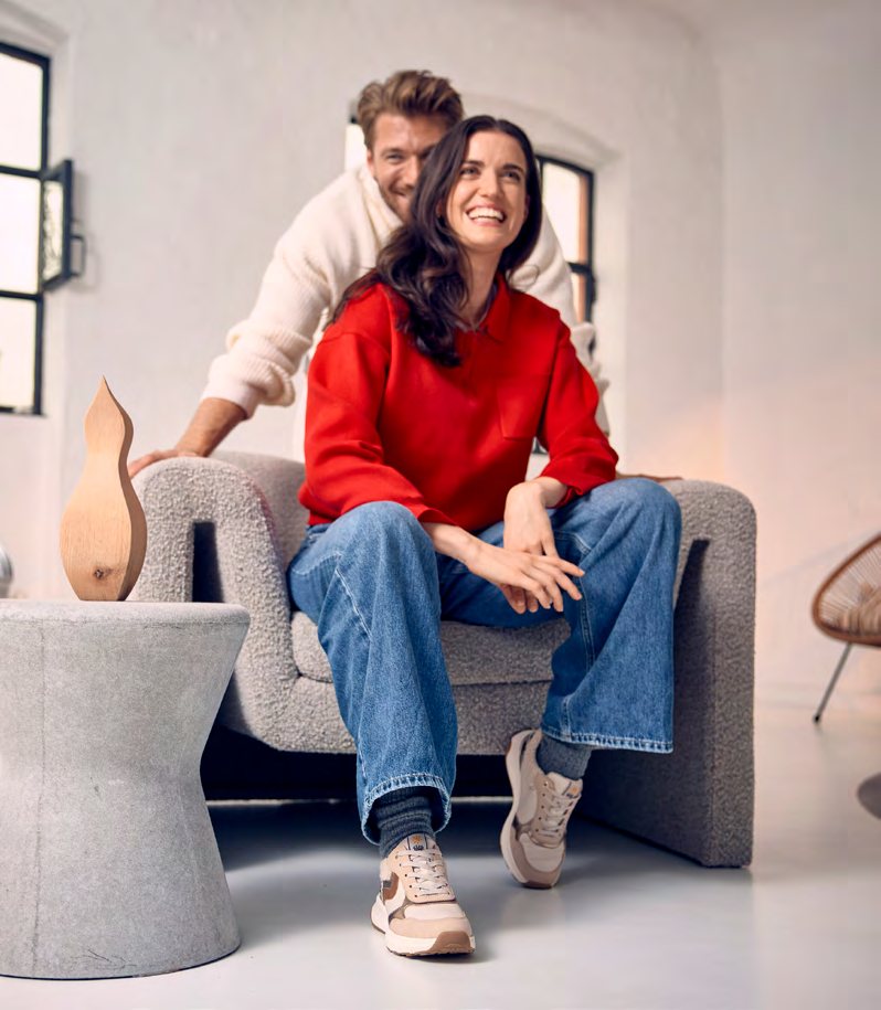 Two people in Relife shoes in a bright living room